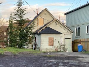 Exterior of an older home listed to sell your house as is