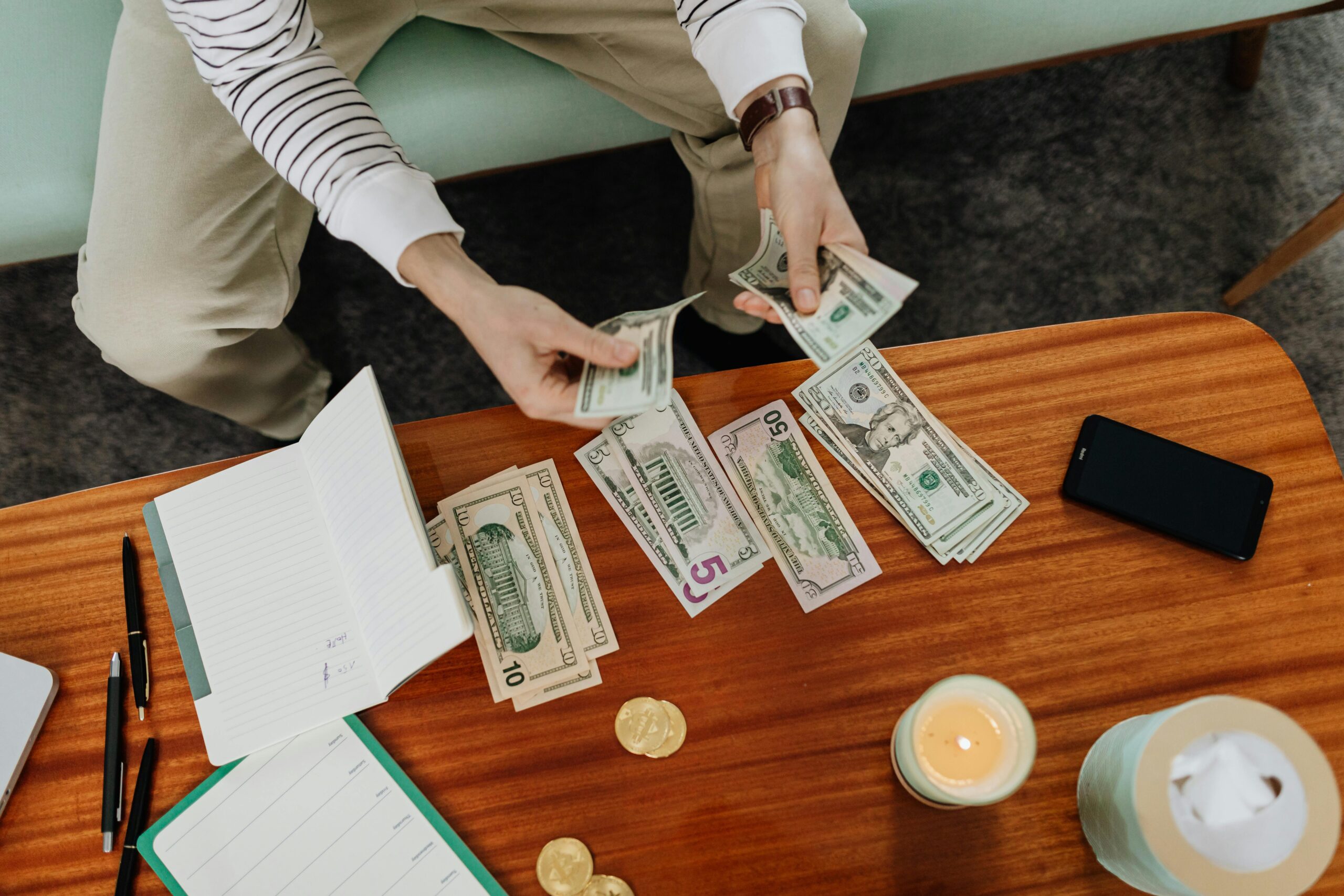 Cash money bills representing the market value of a home.