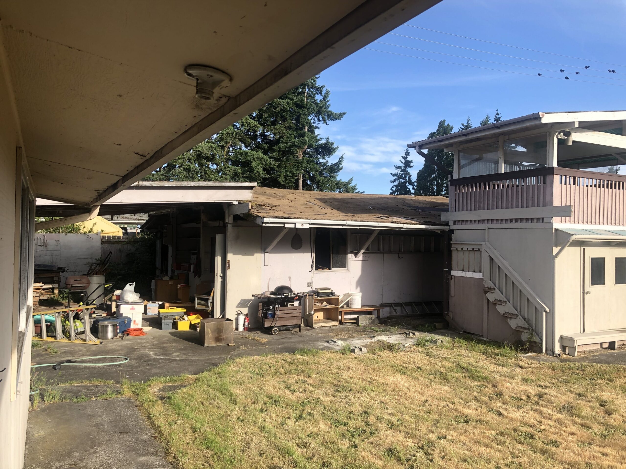 Exterior of a damaged inherited house in need of repairs before selling inherited property.